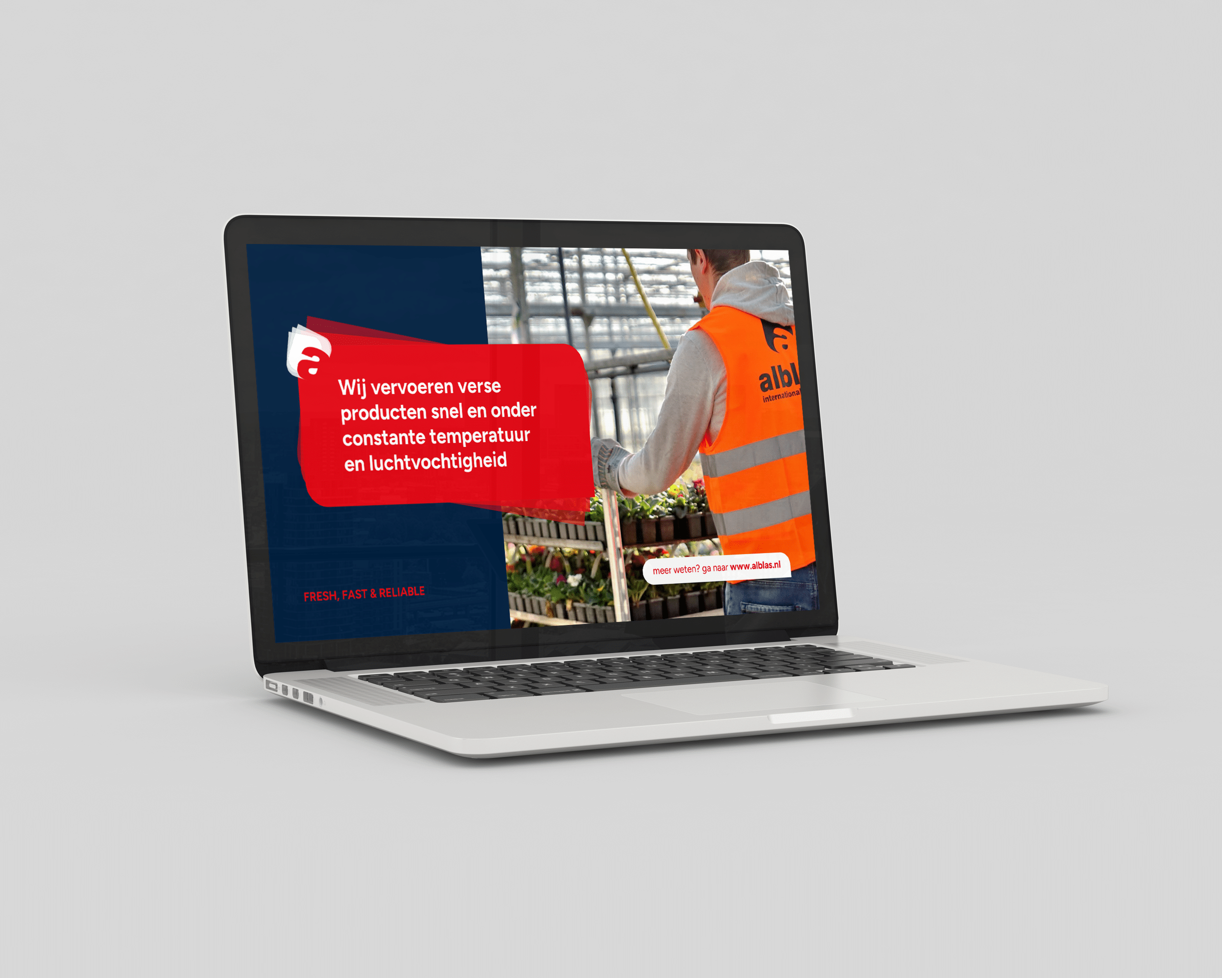 BURO210 Fullservice Marketingbureau Laptop met de website van Alblas International Transport, waarop te zien is dat zij verse producten snel en onder constante temperatuur vervoeren.